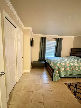 a bedroom with a bed and a walk in closet