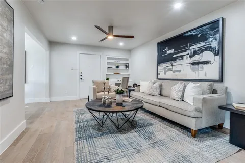 a living room with furniture and a rug