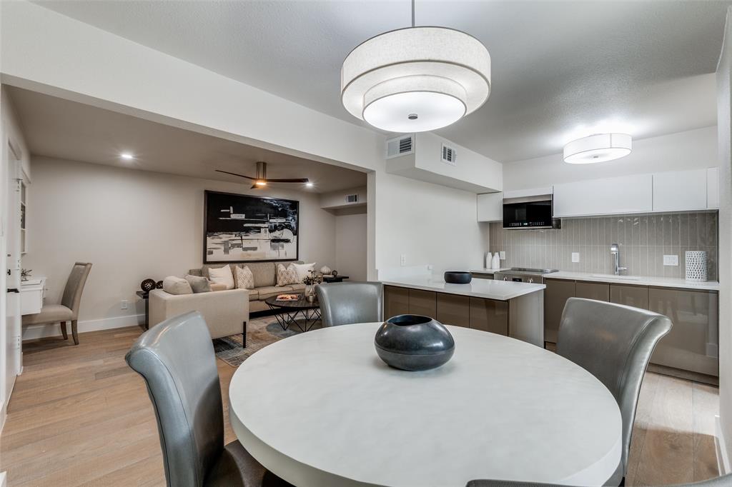 4676 Matilda Street, Unit C Dallas, TX 75206 - Photo 7 of 12 a kitchen with a dining table and chairs