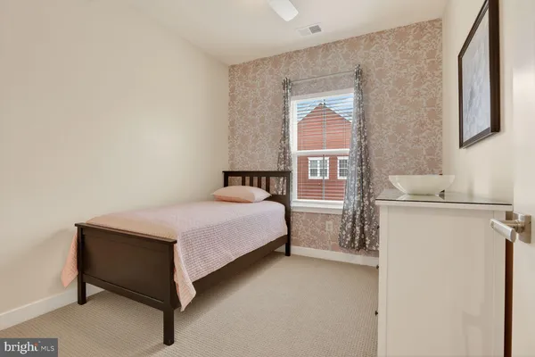 a bedroom with a bed and a cabinets