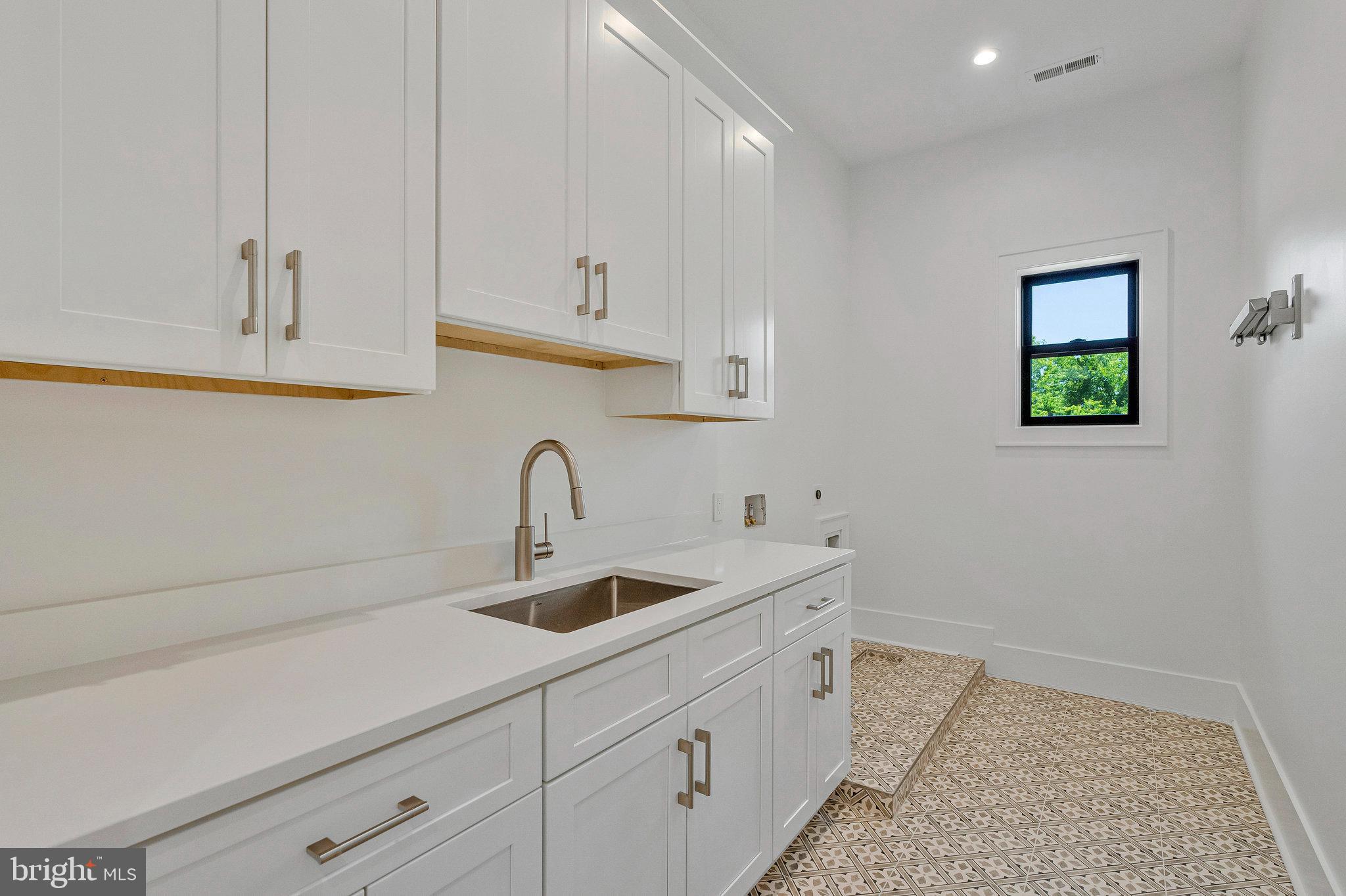 1434 Waggaman Circle McLean, VA 22101 - Photo 80 of 113 Laundry room with cabinets and Sink