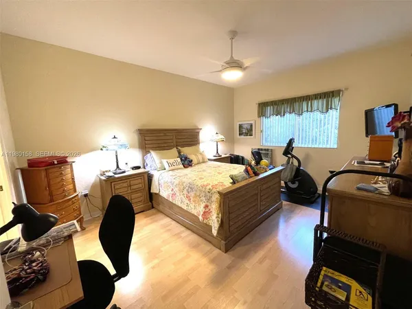 a bed room with bed and window