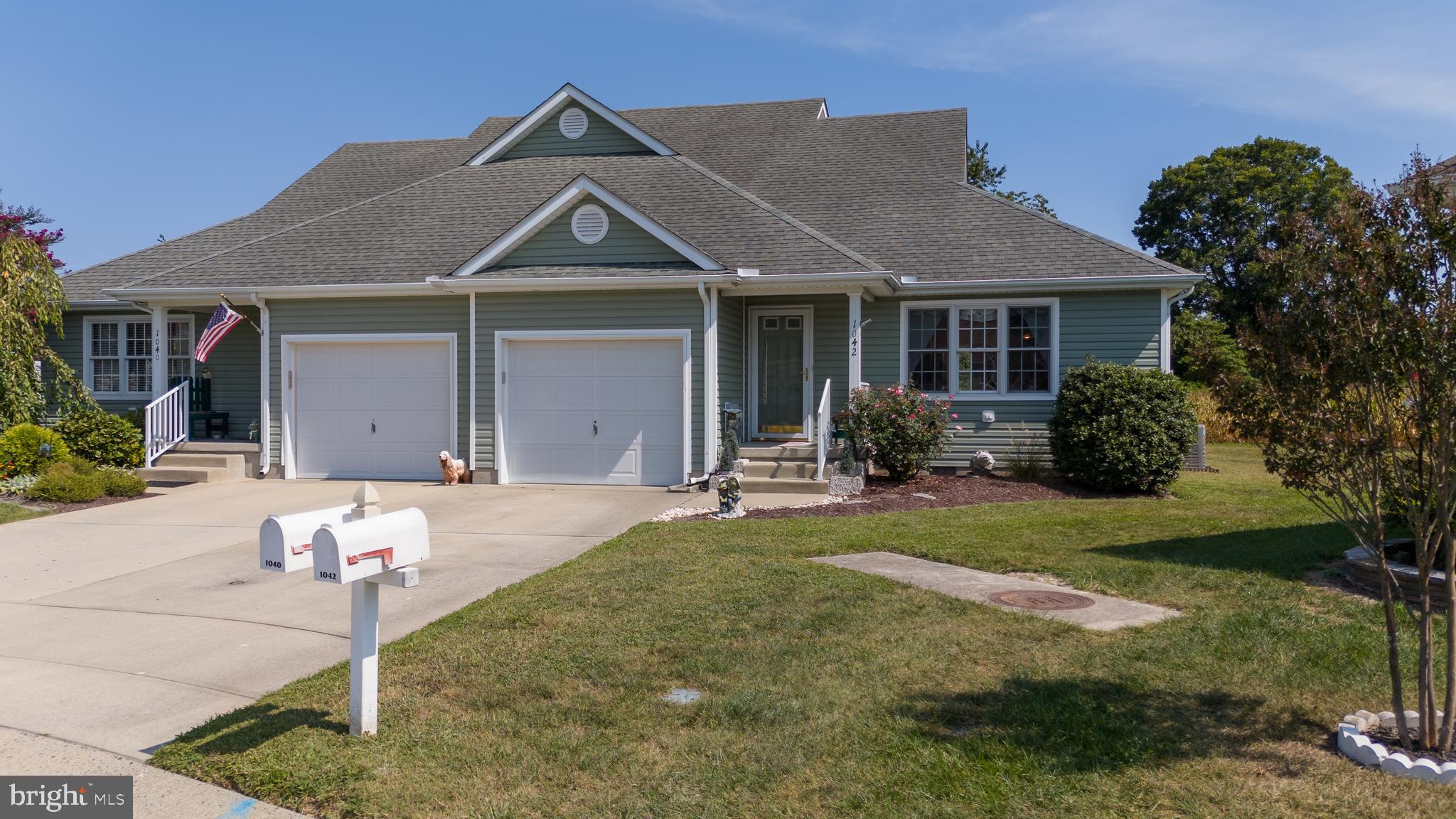 1042 Caravan Way Salisbury, MD 21804 - Photo 1 of 48 a front view of a house with garden