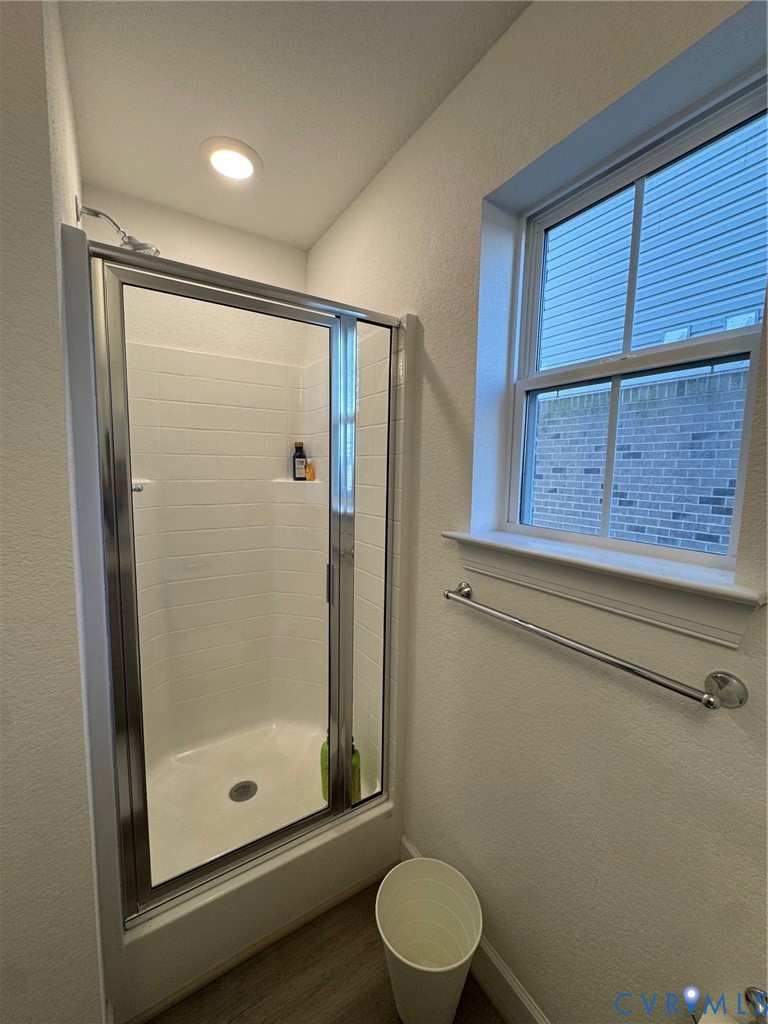 4321 Pinter Lane Norfolk, VA 23518 - Photo 5 of 19 a bathroom with a shower a toilet and a window