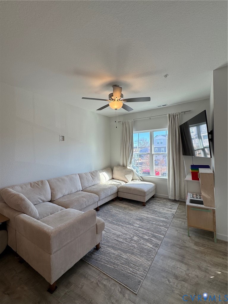 4321 Pinter Lane Norfolk, VA 23518 - Photo 6 of 19 a living room with furniture and a flat screen tv