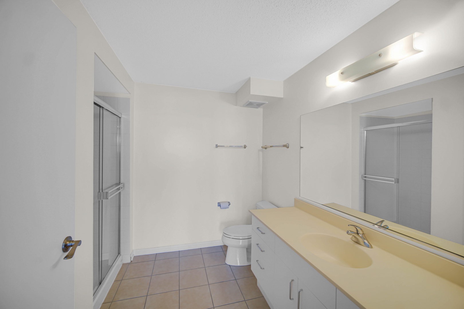 800 Elgin Road, Unit 1210 Evanston, IL 60201 - Photo 16 of 20 a bathroom with a granite countertop sink a toilet and shower