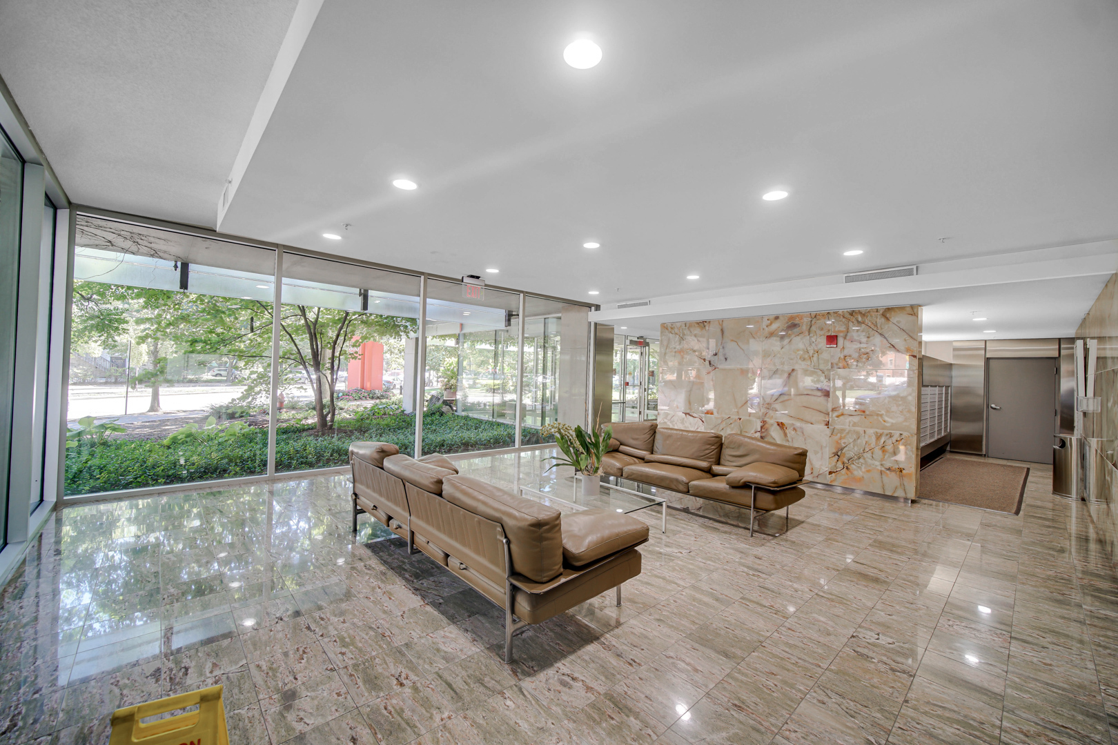 800 Elgin Road, Unit 1210 Evanston, IL 60201 - Photo 20 of 20 a living room with patio furniture and a large window