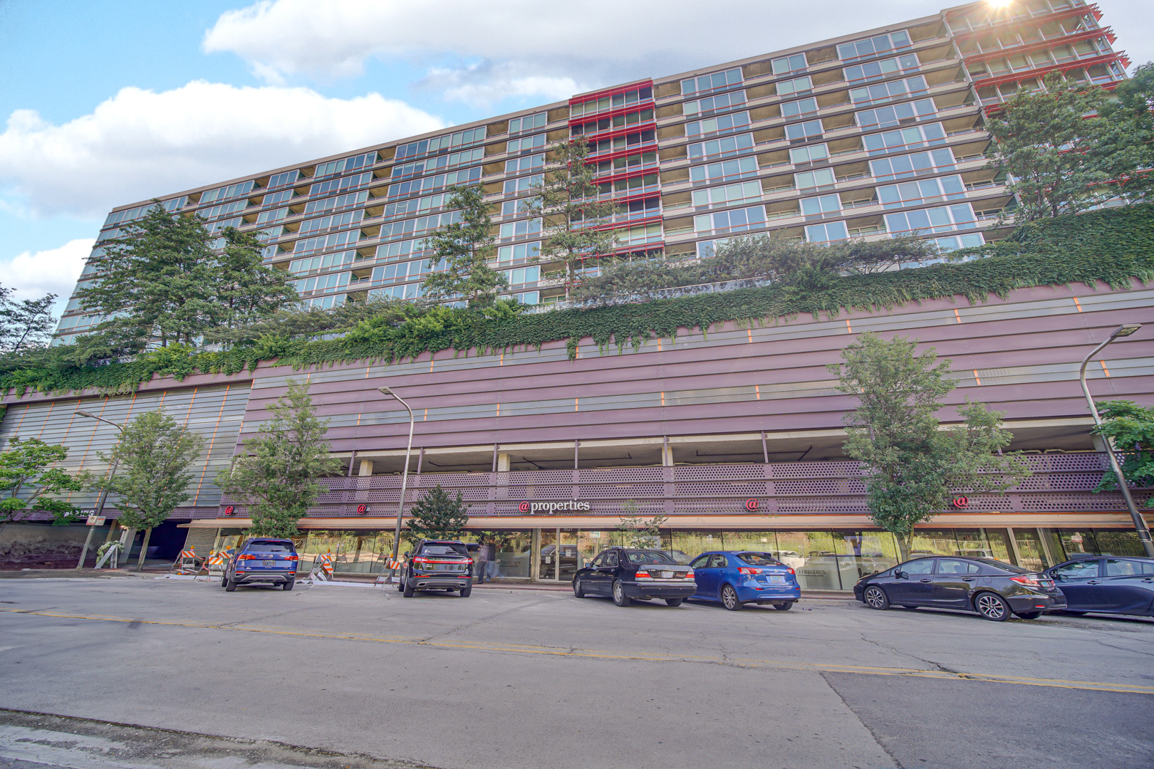 800 Elgin Road, Unit 1210 Evanston, IL 60201 - Photo 3 of 20 a view of parking with a car parked on the road