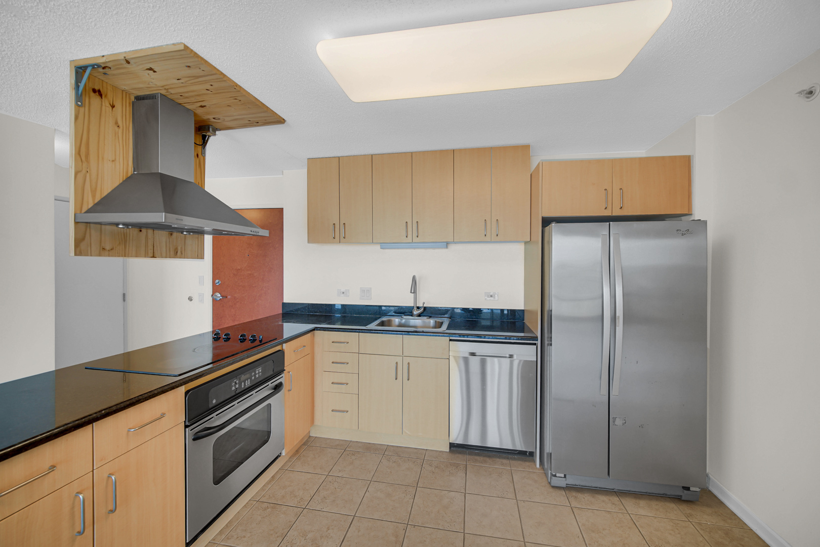 800 Elgin Road, Unit 1210 Evanston, IL 60201 - Photo 8 of 20 a kitchen with stainless steel appliances granite countertop a sink and a refrigerator