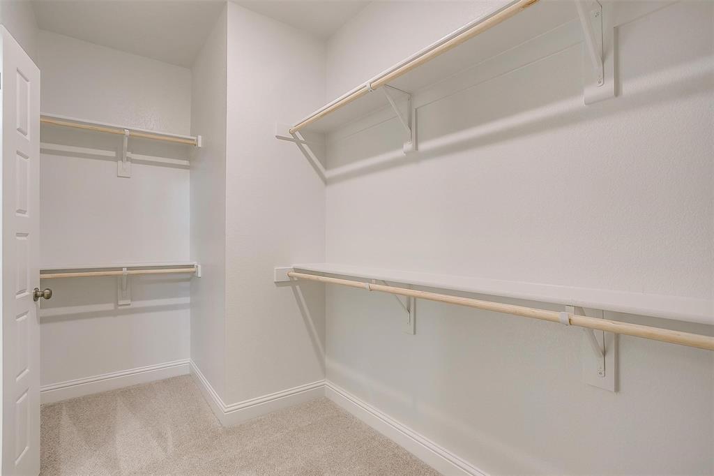 6811 Robert Reed Drive Arlington, TX 76001 - Photo 23 of 34 a view of an empty walk in closet