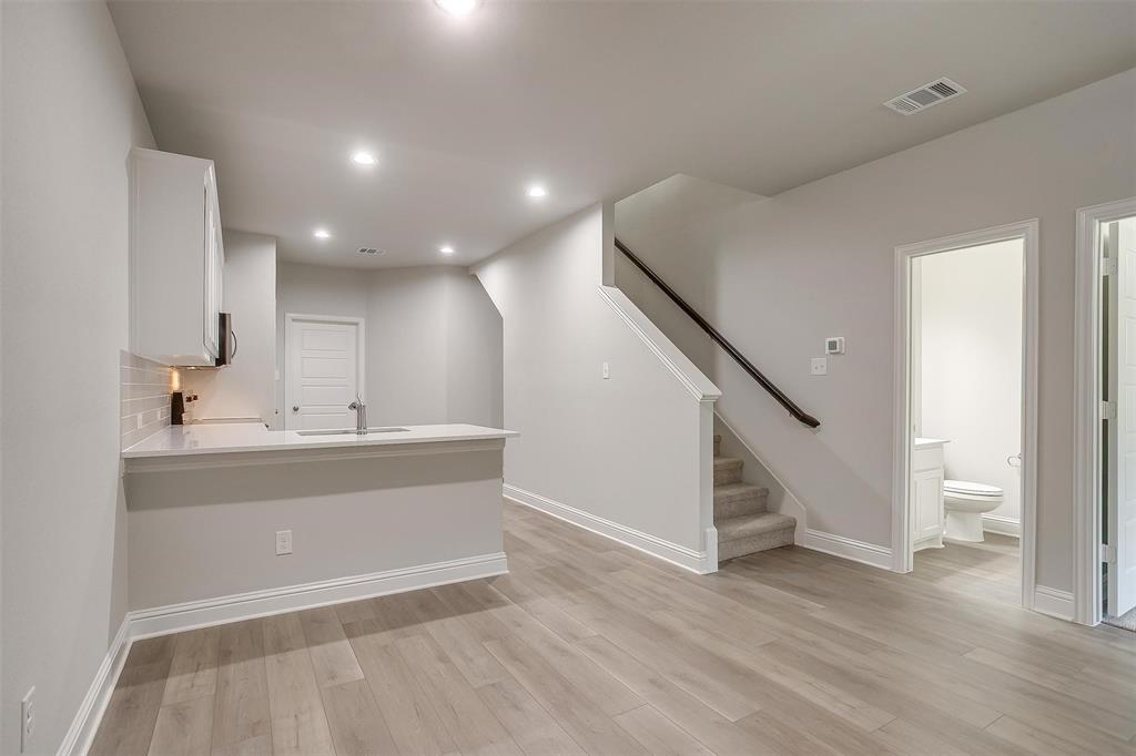 6811 Robert Reed Drive Arlington, TX 76001 - Photo 8 of 34 a view of entryway and hall with wooden floor