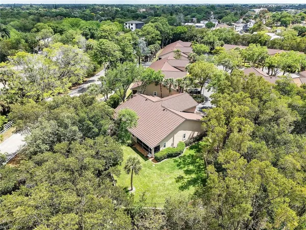 an aerial view of a house with yard