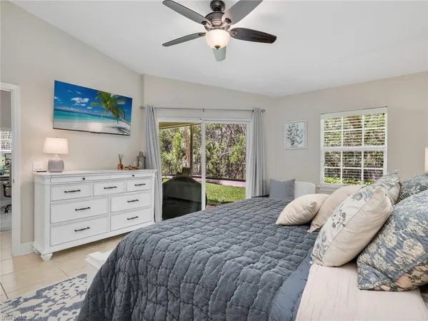 a bed room with a bed and a window