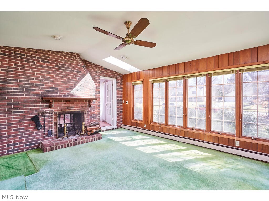 2393 Brice Road Akron, OH 44313 - Photo 9 of 24 4 seasons sunroom with fireplace.