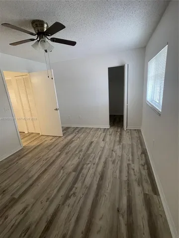wooden floor in a hall with an entryway