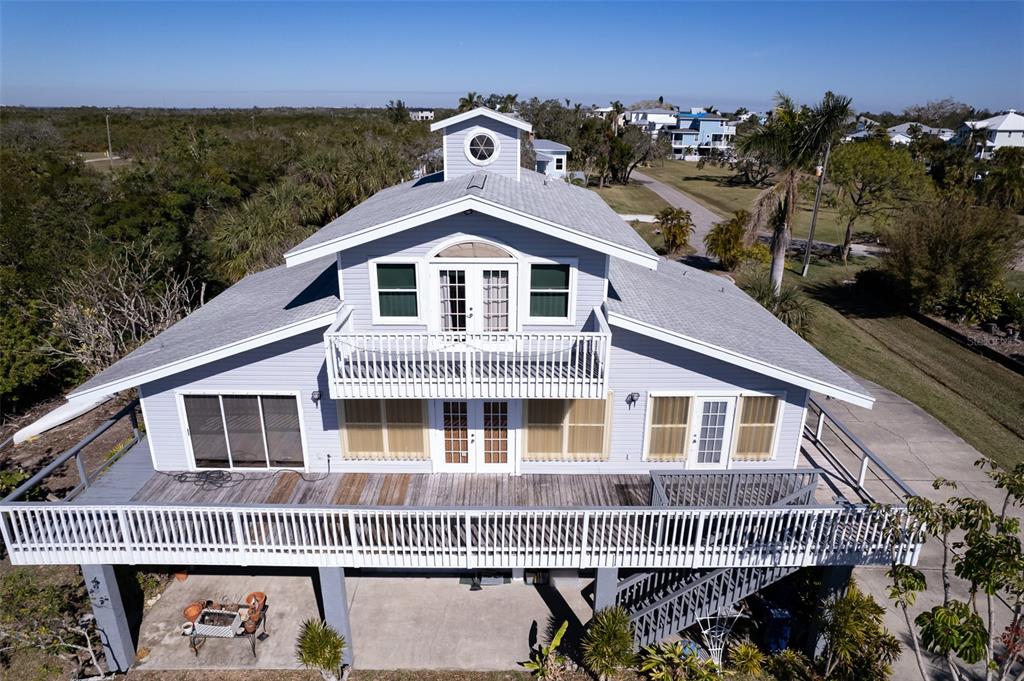 145 Burns Road Terra Ceia, FL 34250 - Photo 41 of 65 a front view of a house with a yard