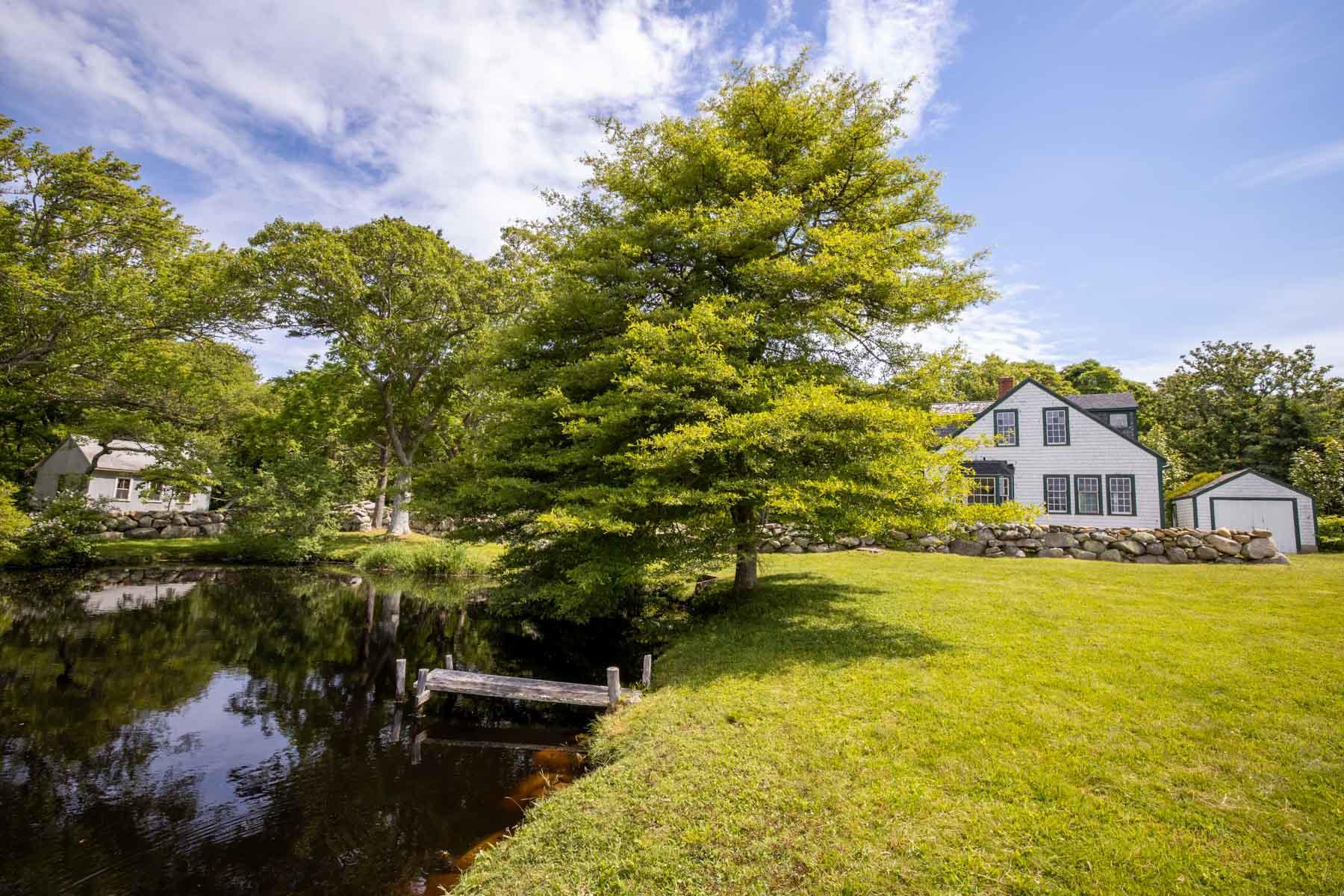 277 N Road Chilmark, MA 02535 - Photo 4 of 14 a view of a house with a yard