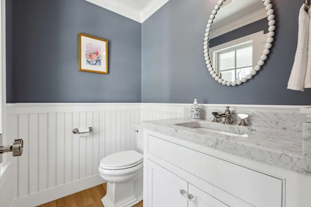 a living room with furniture a fireplace and a table