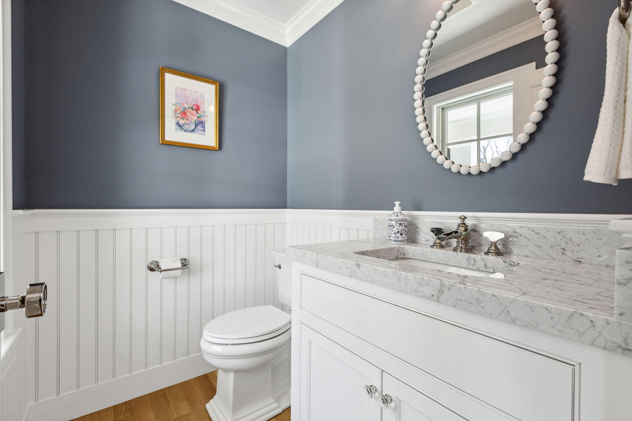 44 Tonset Road Orleans, MA 02653 - Photo 12 of 79 a bathroom with a granite countertop toilet a sink a mirror and a window