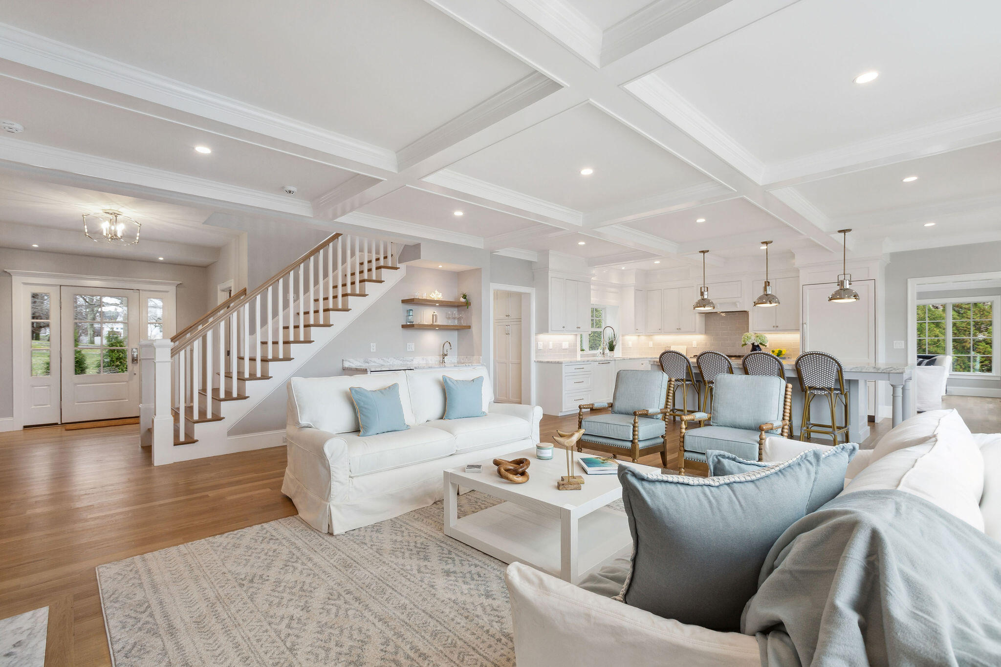 44 Tonset Road Orleans, MA 02653 - Photo 16 of 79 a living room with furniture kitchen view and a wooden floor