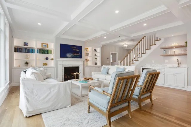 a bathroom with a double vanity sink a toilet and a bathtub