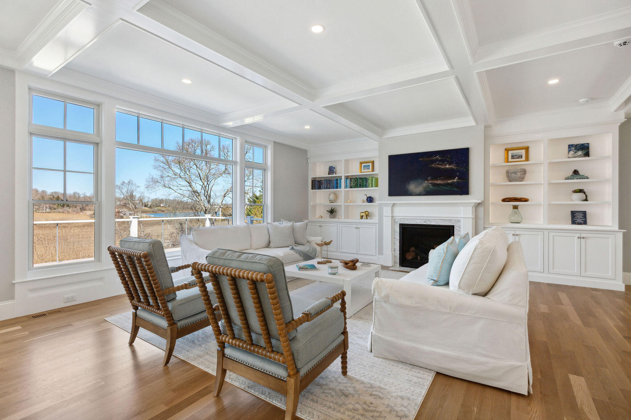 44 Tonset Road Orleans, MA 02653 - Photo 18 of 79 a living room with furniture a fireplace and a flat screen tv