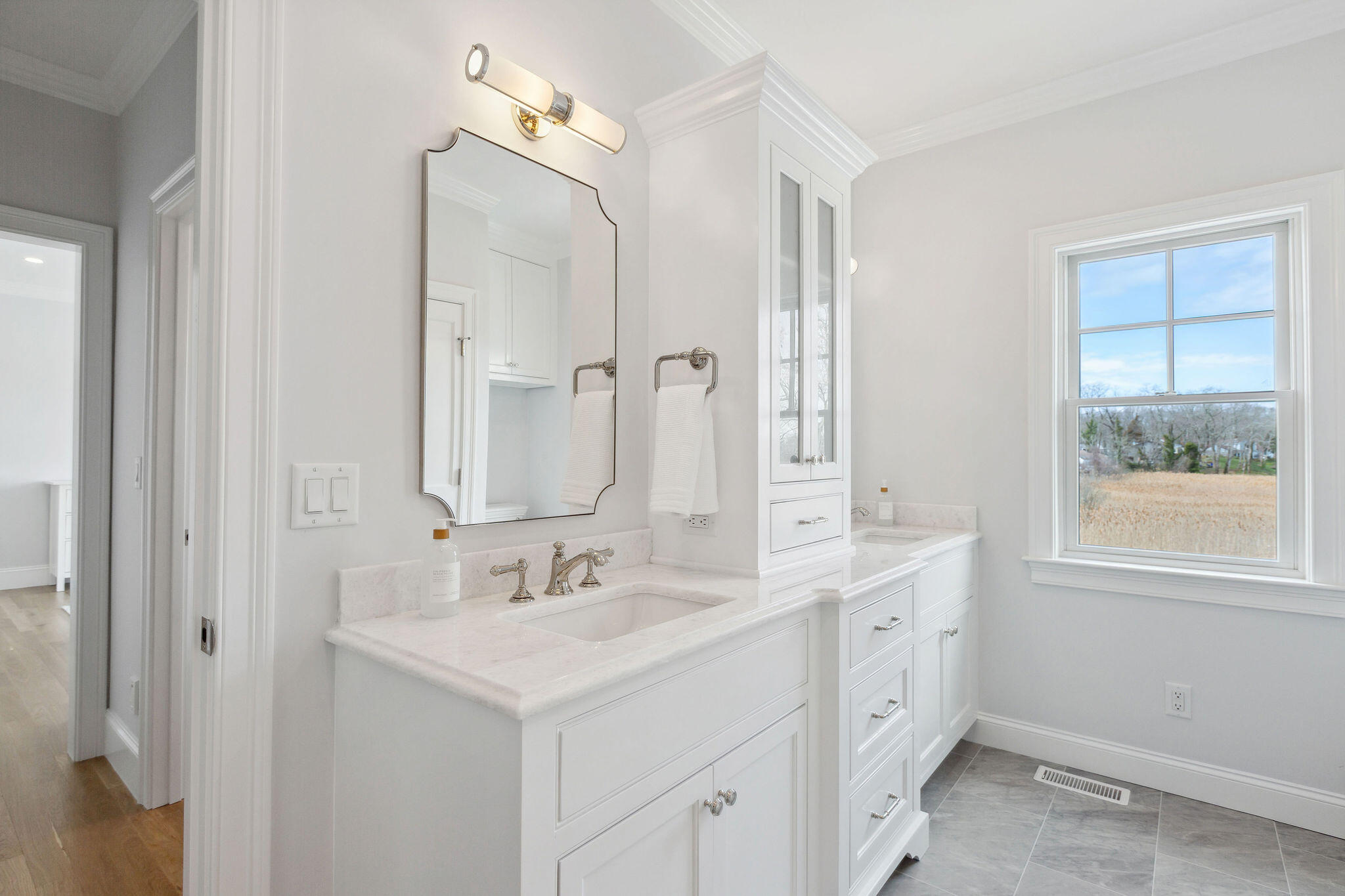 44 Tonset Road Orleans, MA 02653 - Photo 36 of 79 a bathroom with a sink double vanity and a mirror