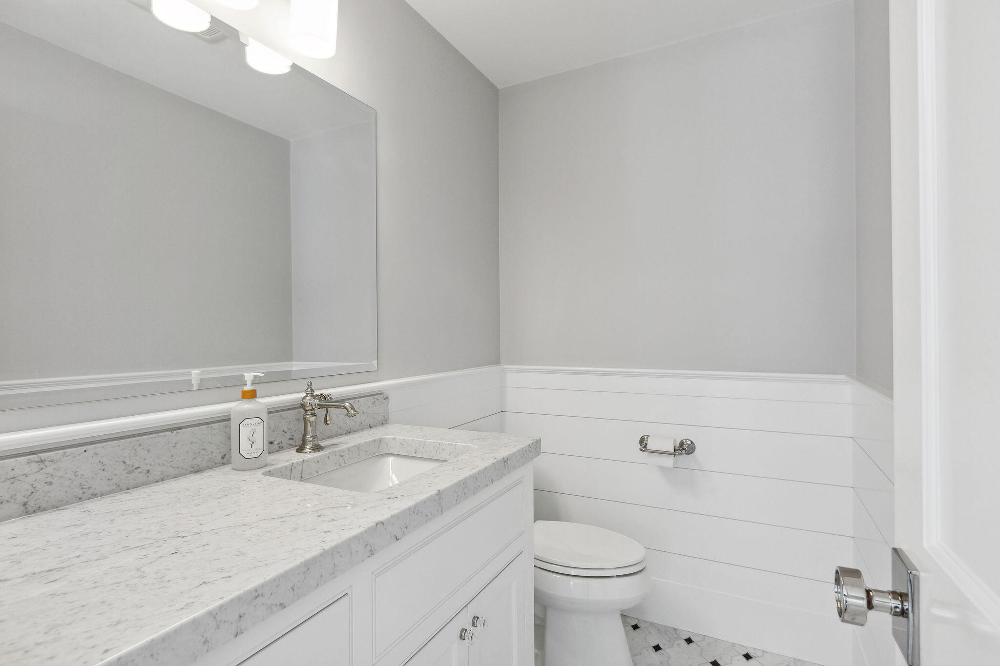 44 Tonset Road Orleans, MA 02653 - Photo 44 of 79 a bathroom with a granite countertop sink a toilet and a mirror