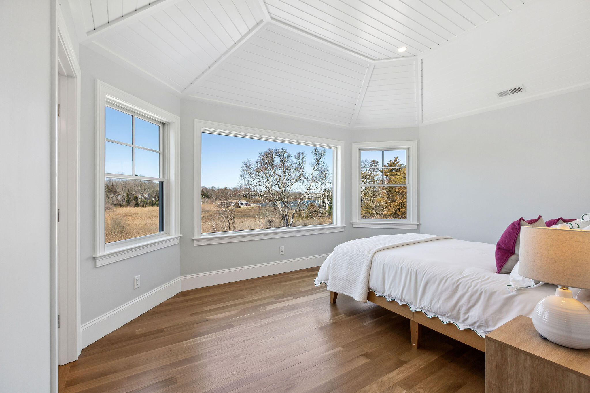 44 Tonset Road Orleans, MA 02653 - Photo 46 of 79 a bedroom with a bed and a large window