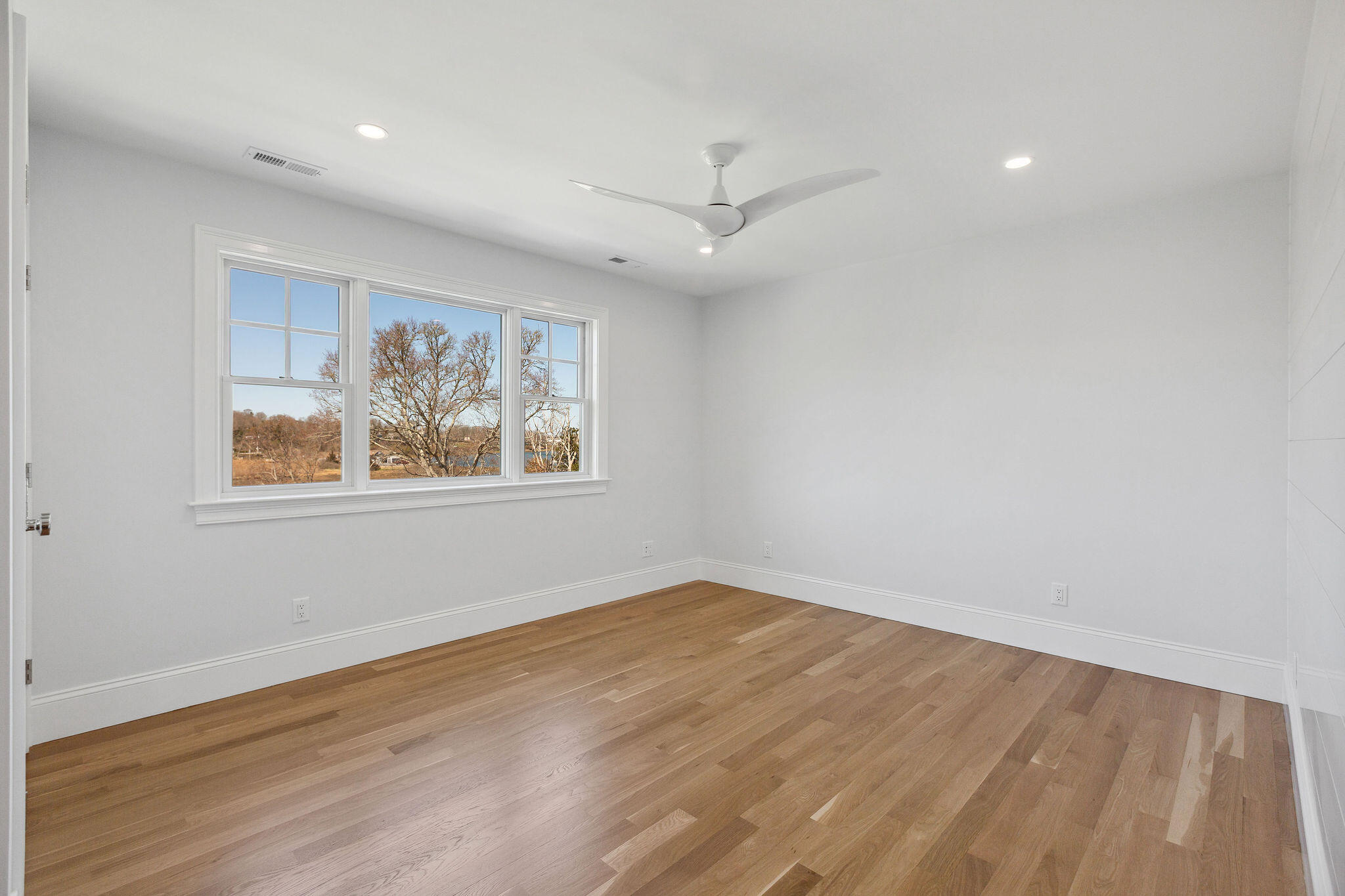 44 Tonset Road Orleans, MA 02653 - Photo 51 of 79 wooden floor in an empty room with a window