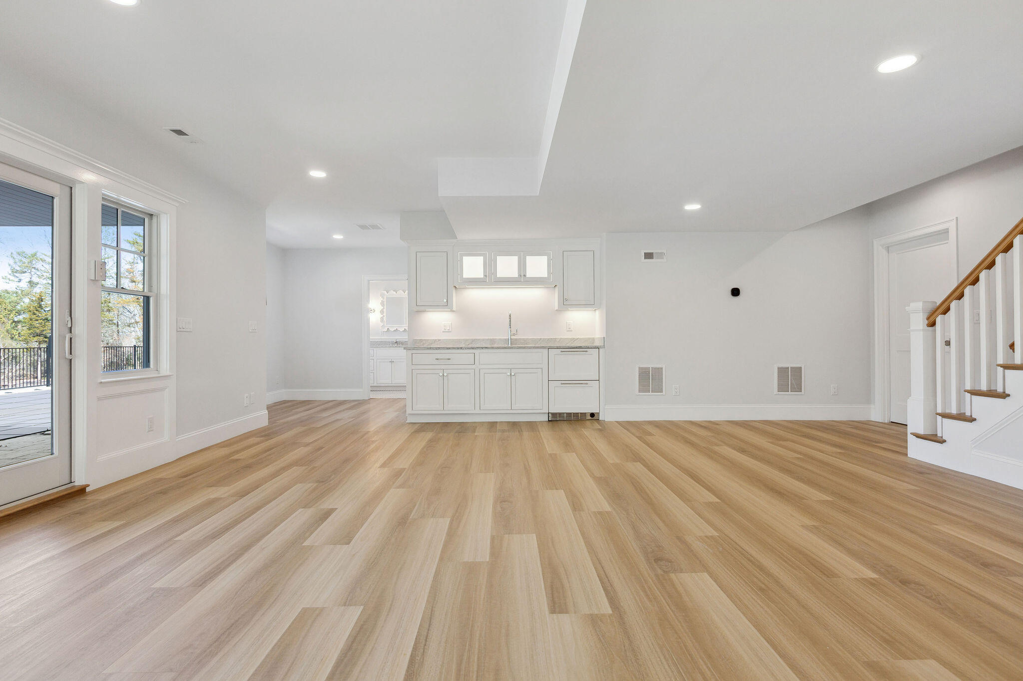 44 Tonset Road Orleans, MA 02653 - Photo 59 of 79 a view of a bedroom with wooden floor and windows