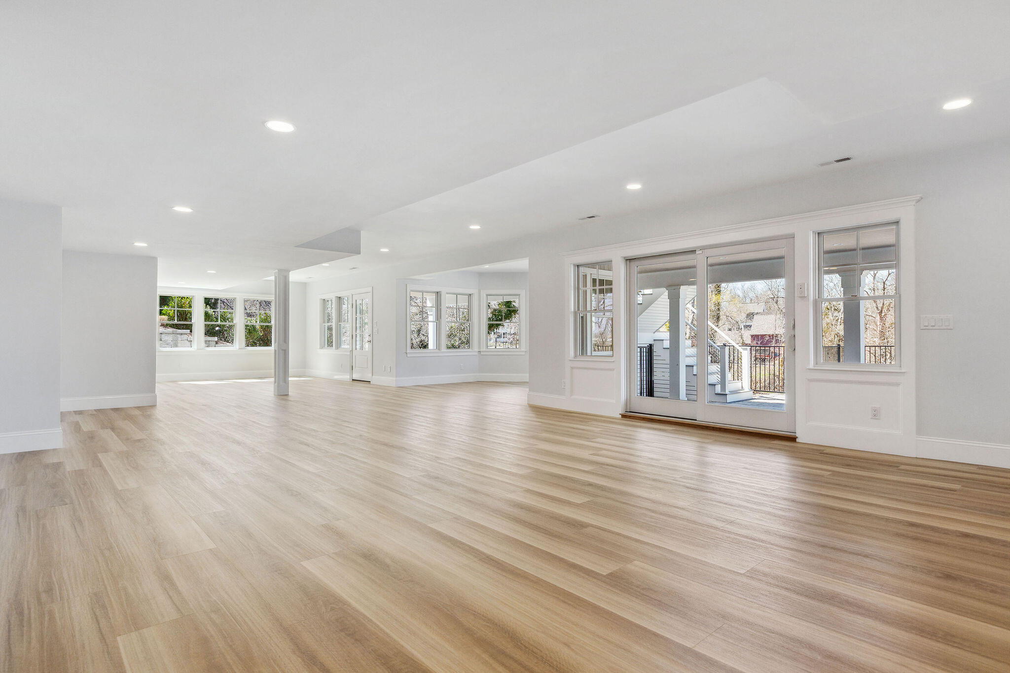 44 Tonset Road Orleans, MA 02653 - Photo 60 of 79 a view of an empty room with wooden floor and a floor to ceiling window