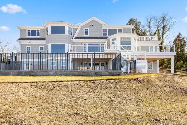 a dining room with furniture a rug and wooden floor