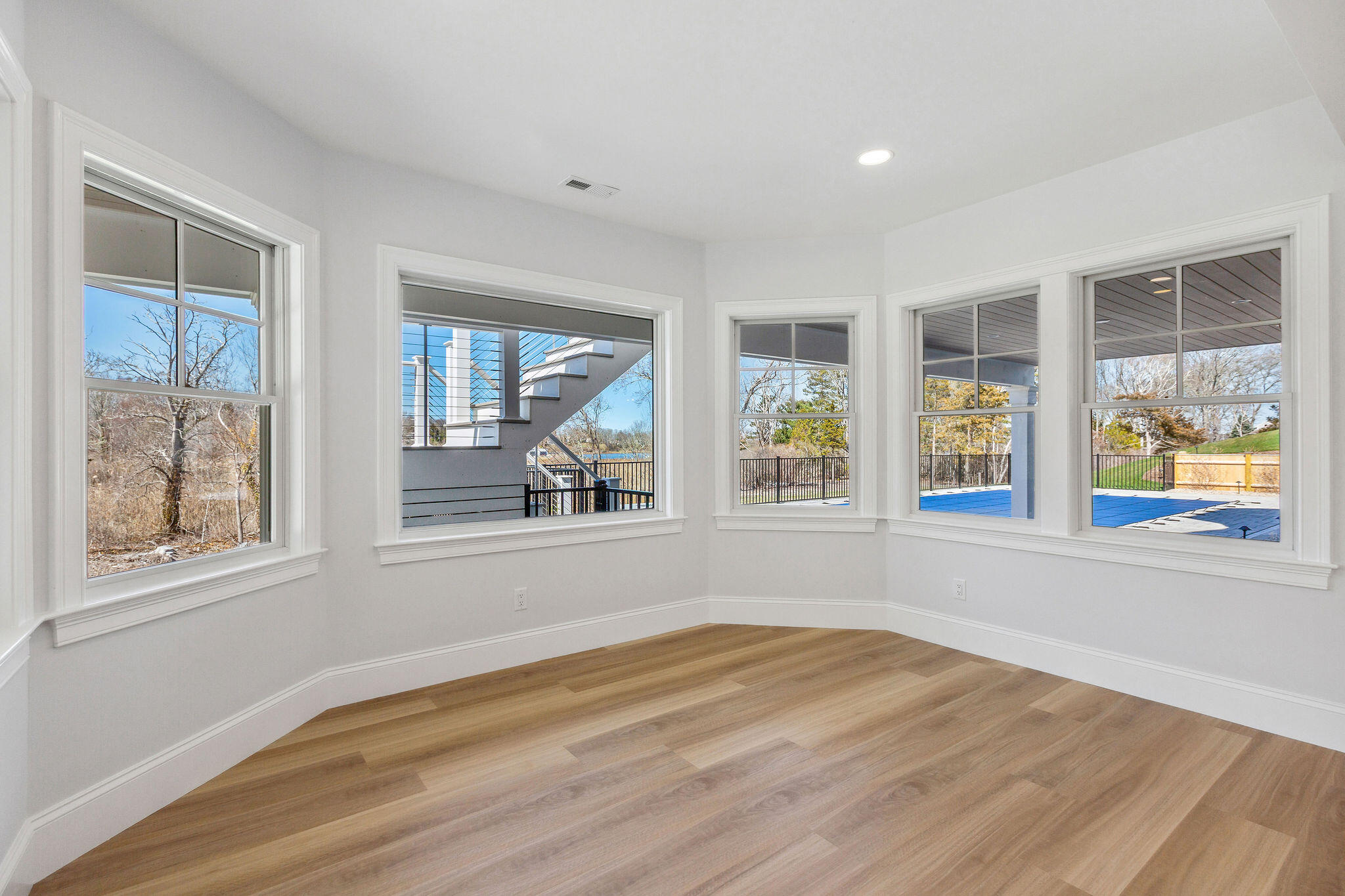 44 Tonset Road Orleans, MA 02653 - Photo 61 of 79 an empty room with wooden floor and windows