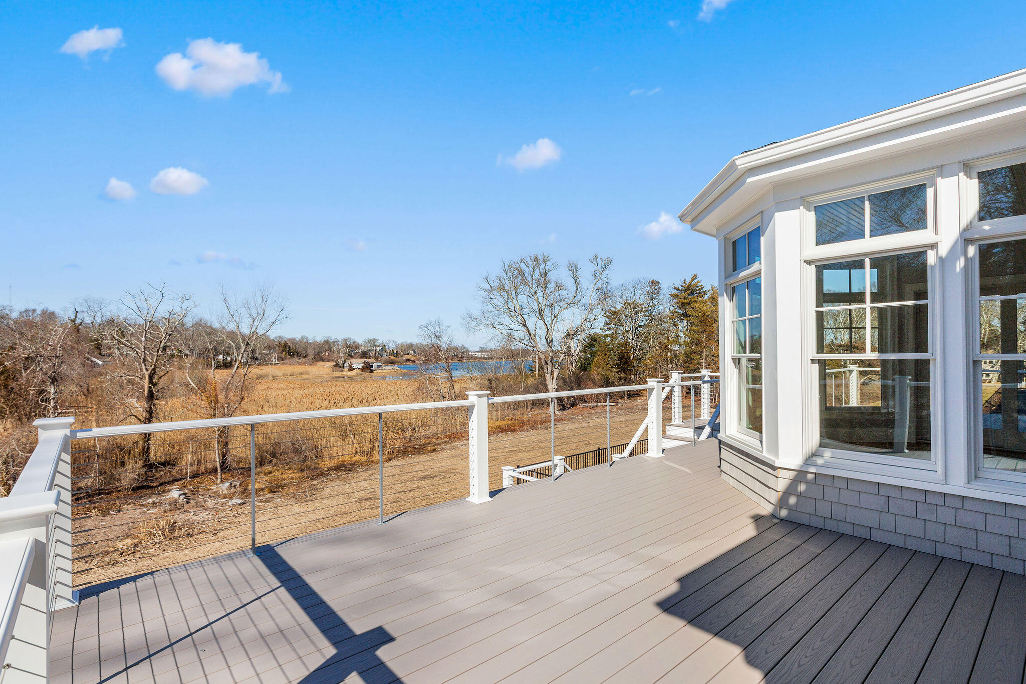 44 Tonset Road Orleans, MA 02653 - Photo 69 of 79 a view of a balcony with wooden floor and outdoor space