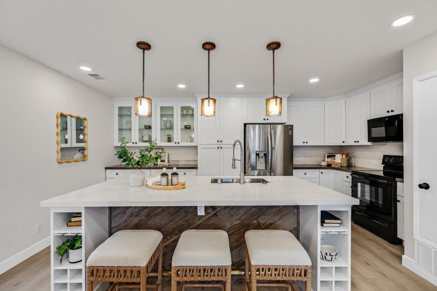 205 Red Oak Drive, Unit M Sunnyvale, CA 94086 - Photo 11 of 32 a kitchen with stainless steel appliances granite countertop a stove a refrigerator a kitchen island a dining table and chairs