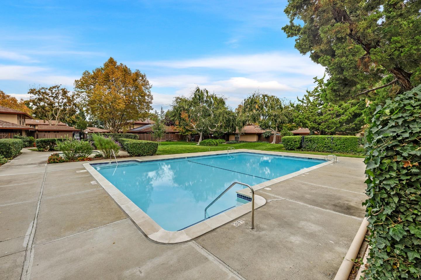 205 Red Oak Drive, Unit M Sunnyvale, CA 94086 - Photo 30 of 32 an aerial view of a tennis ground with large trees