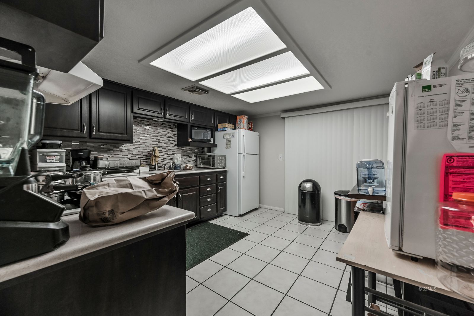 721 North Balsam Street Ridgecrest, CA 93555 - Photo 3 of 16 a kitchen with refrigerator and stove