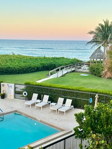 a kitchen that has a sink and a stove in it