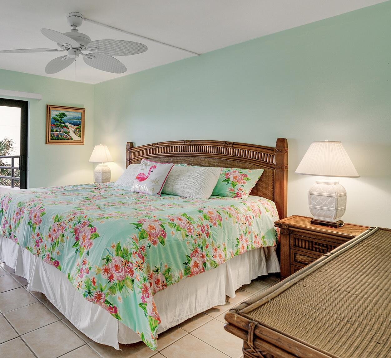 420 Celestial Way, Unit 301 Juno Beach, FL 33408 - Photo 36 of 51 a bedroom with a bed table and window