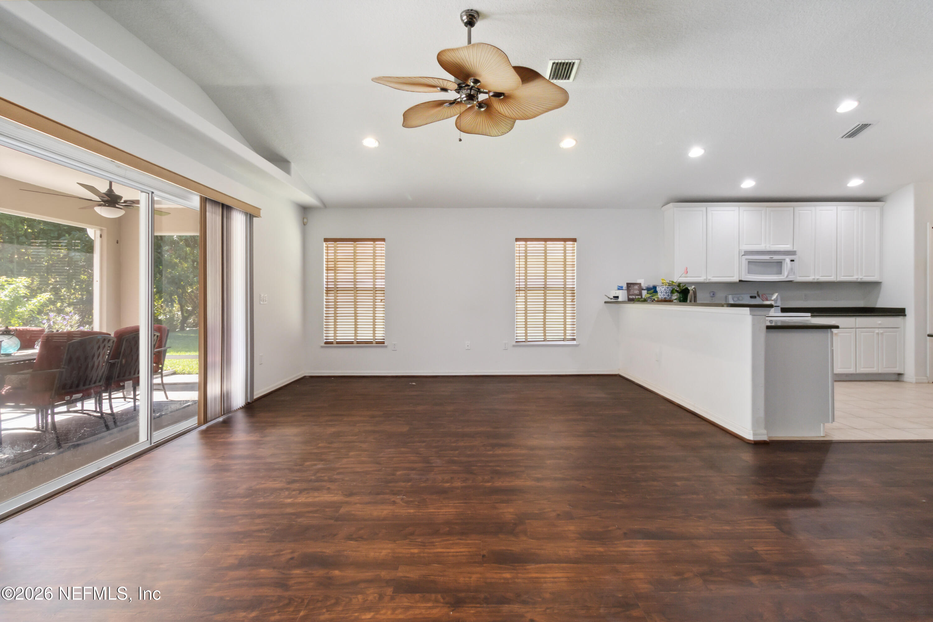 940 Tavernier Circle Northeast Palm Bay, FL 32905 - Photo 17 of 31 a view of an empty room with kitchen and window