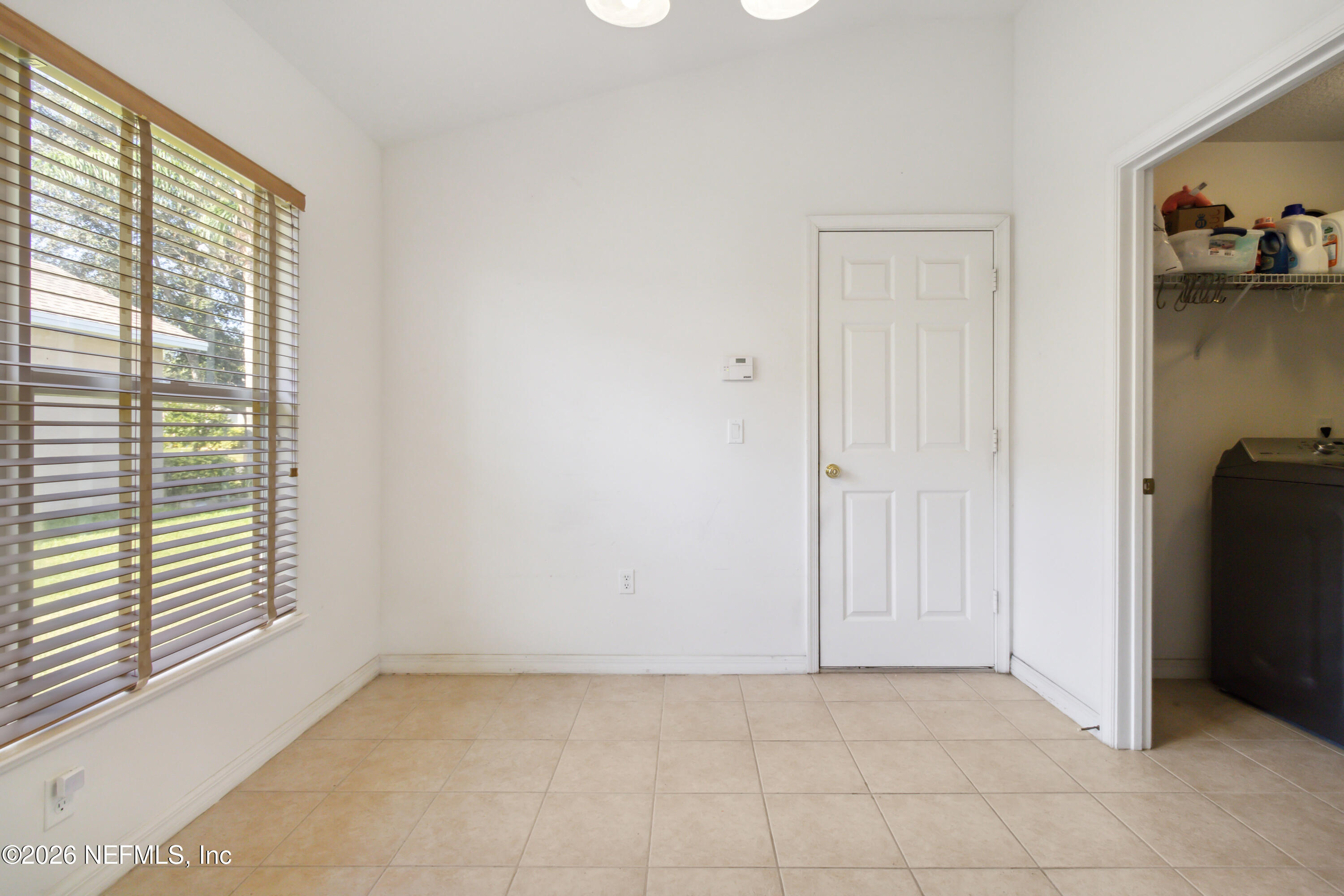 940 Tavernier Circle Northeast Palm Bay, FL 32905 - Photo 18 of 31 a view of an empty room with a window