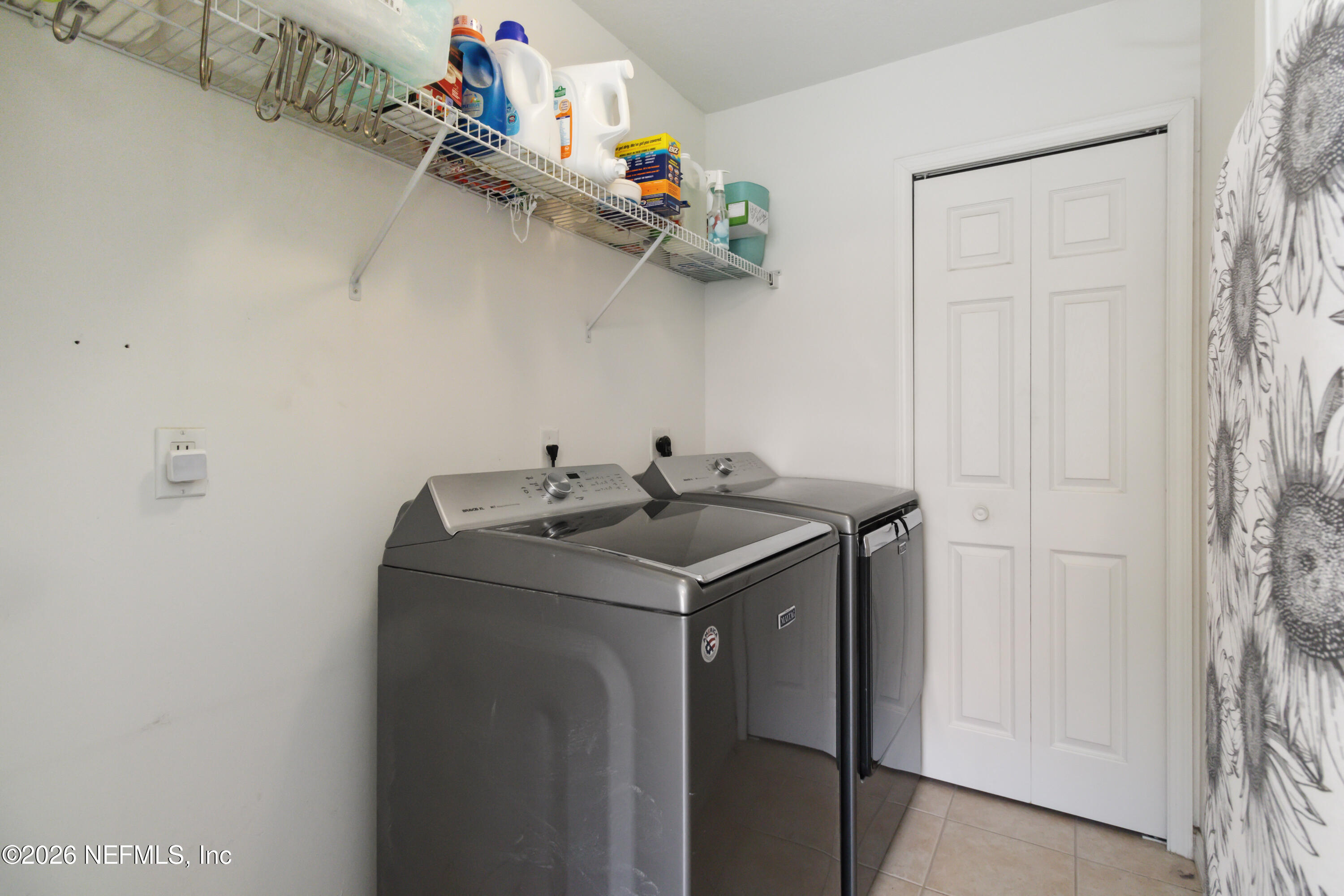 940 Tavernier Circle Northeast Palm Bay, FL 32905 - Photo 19 of 31 a utility room with dryer and washer