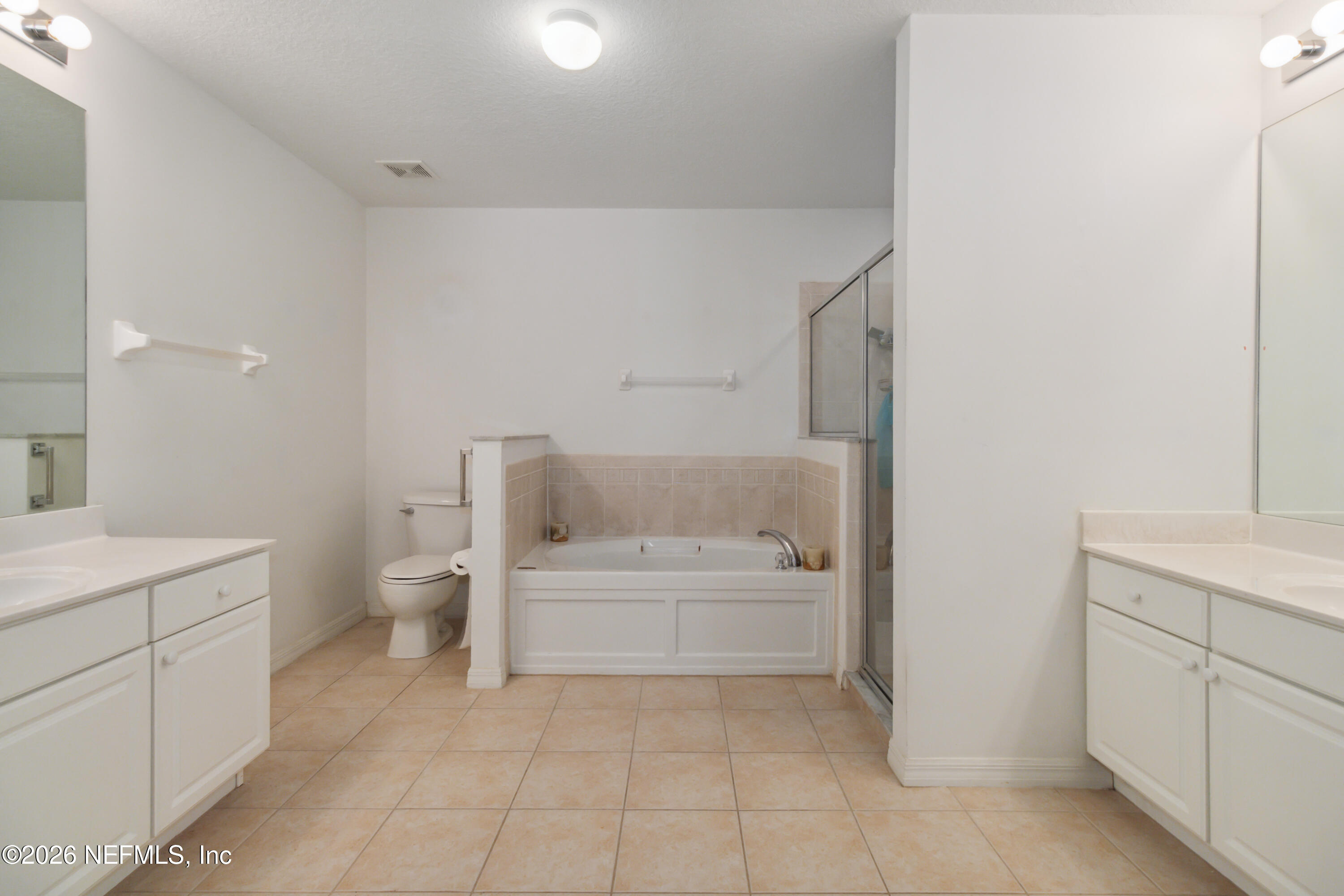940 Tavernier Circle Northeast Palm Bay, FL 32905 - Photo 22 of 31 a bathroom with a bathtub sink and toilet