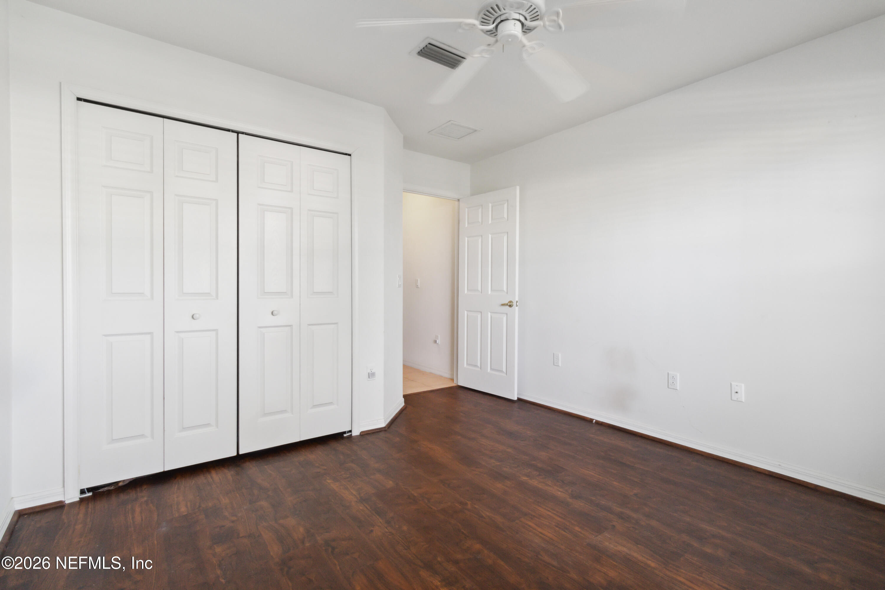 940 Tavernier Circle Northeast Palm Bay, FL 32905 - Photo 28 of 31 a view of an empty room with wooden floor