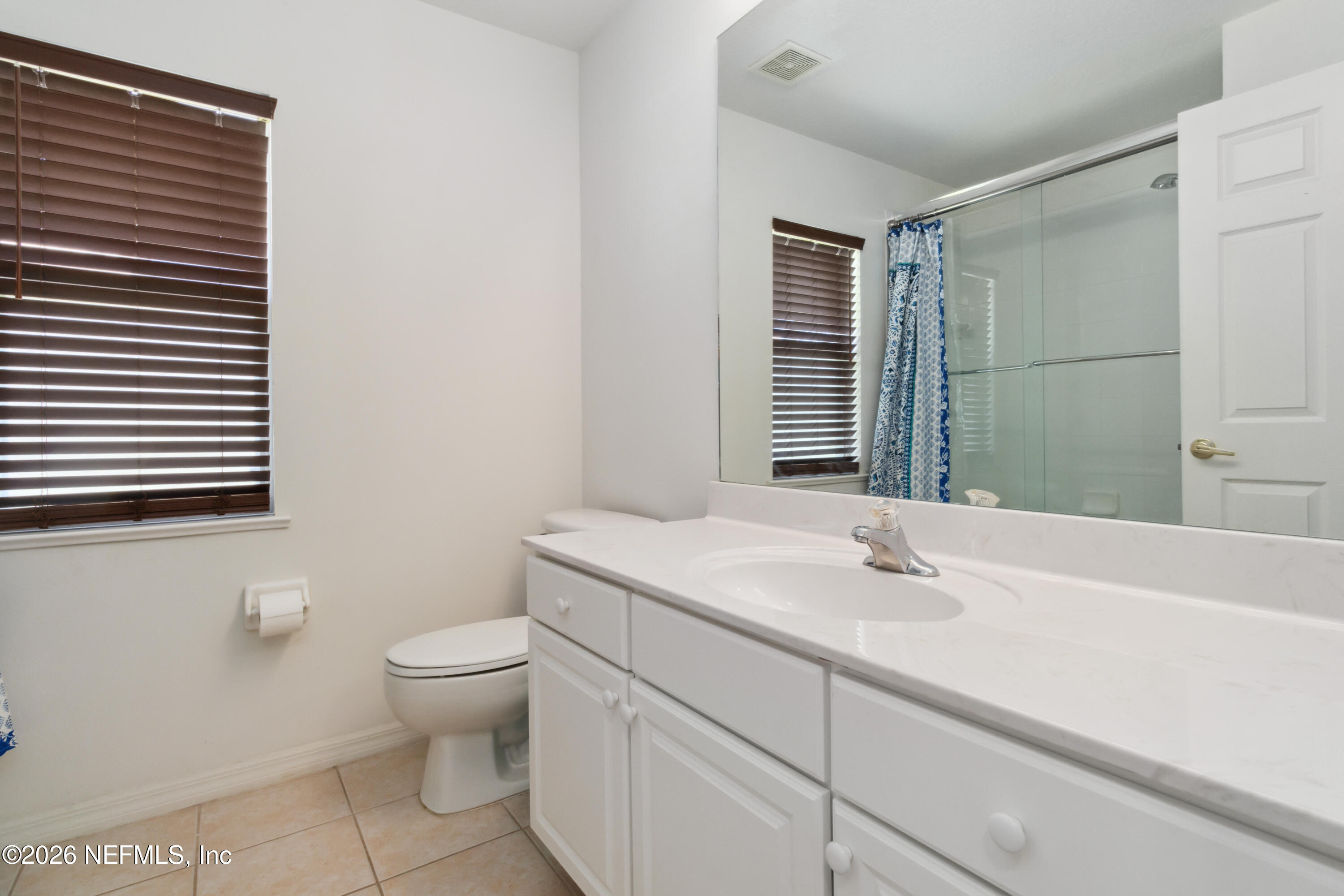 940 Tavernier Circle Northeast Palm Bay, FL 32905 - Photo 29 of 31 a bathroom with a sink toilet and shower