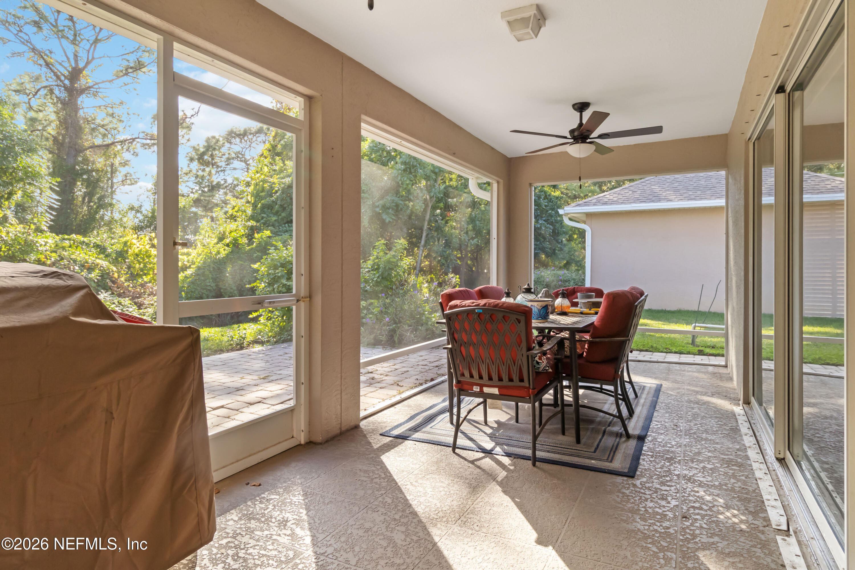 940 Tavernier Circle Northeast Palm Bay, FL 32905 - Photo 30 of 31 a view of a dining room with furniture window and outside view