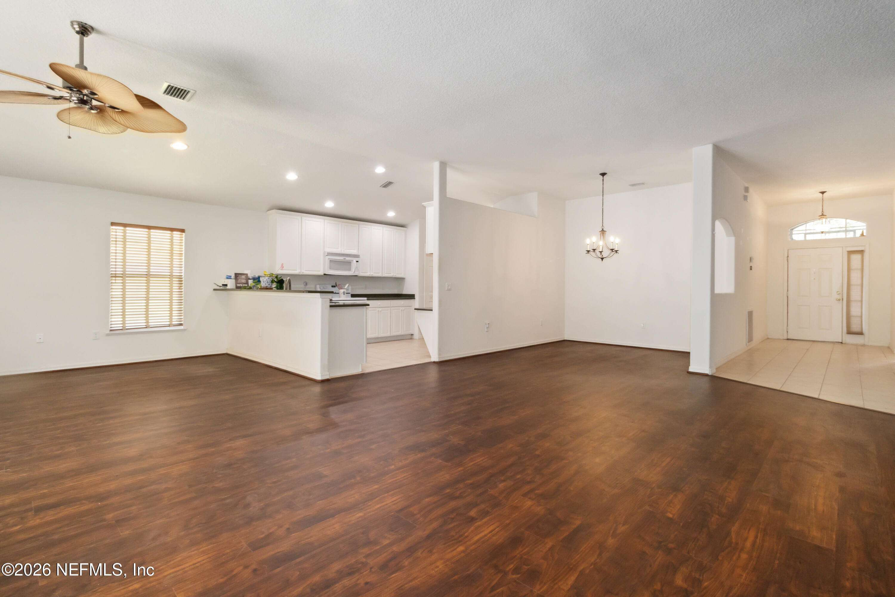 940 Tavernier Circle Northeast Palm Bay, FL 32905 - Photo 5 of 31 a view of a kitchen with a sink and a window