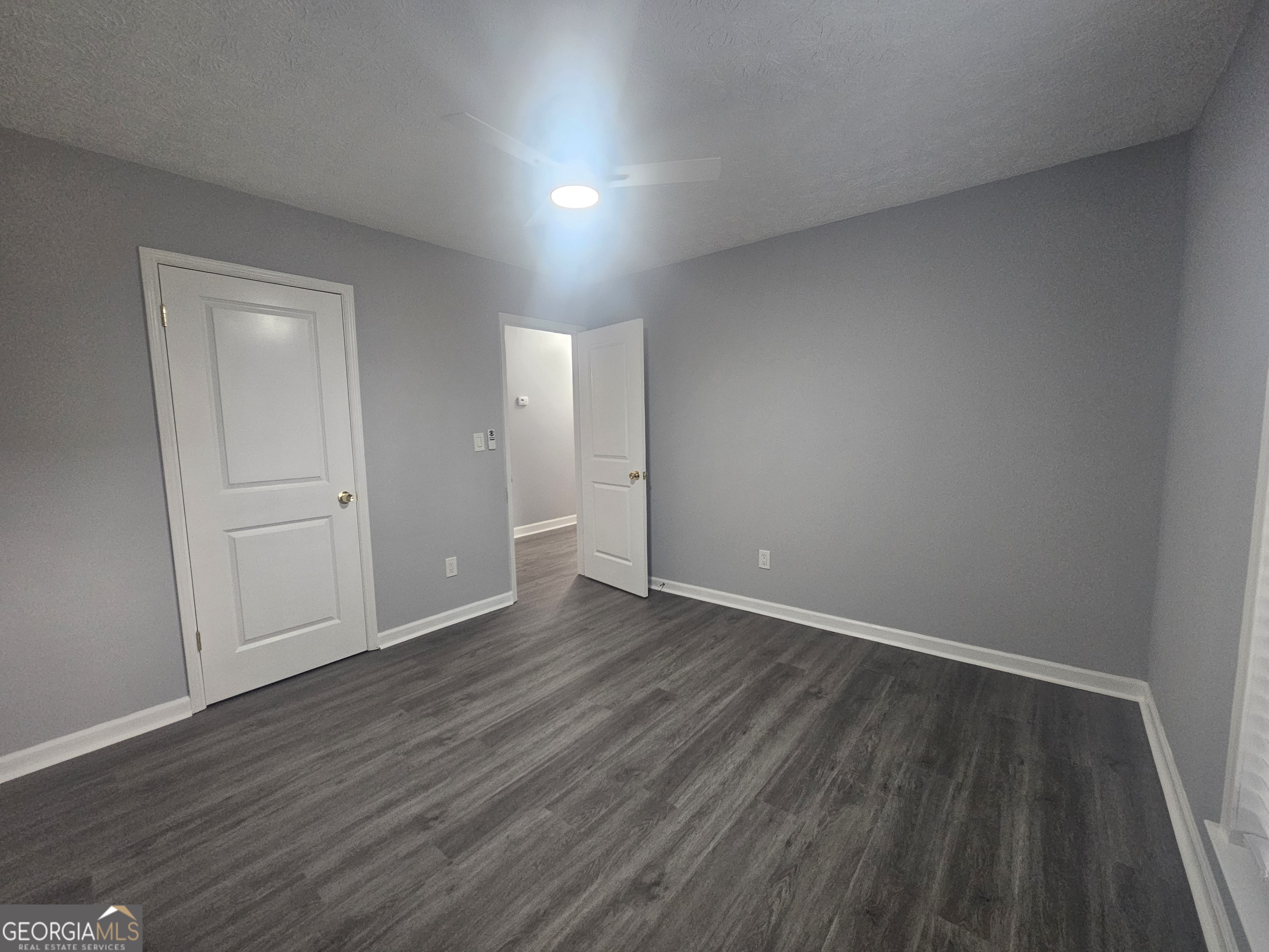 391 Park Ridge Circle Riverdale, GA 30274 - Photo 29 of 42 a view of an empty room with wooden floor and closet