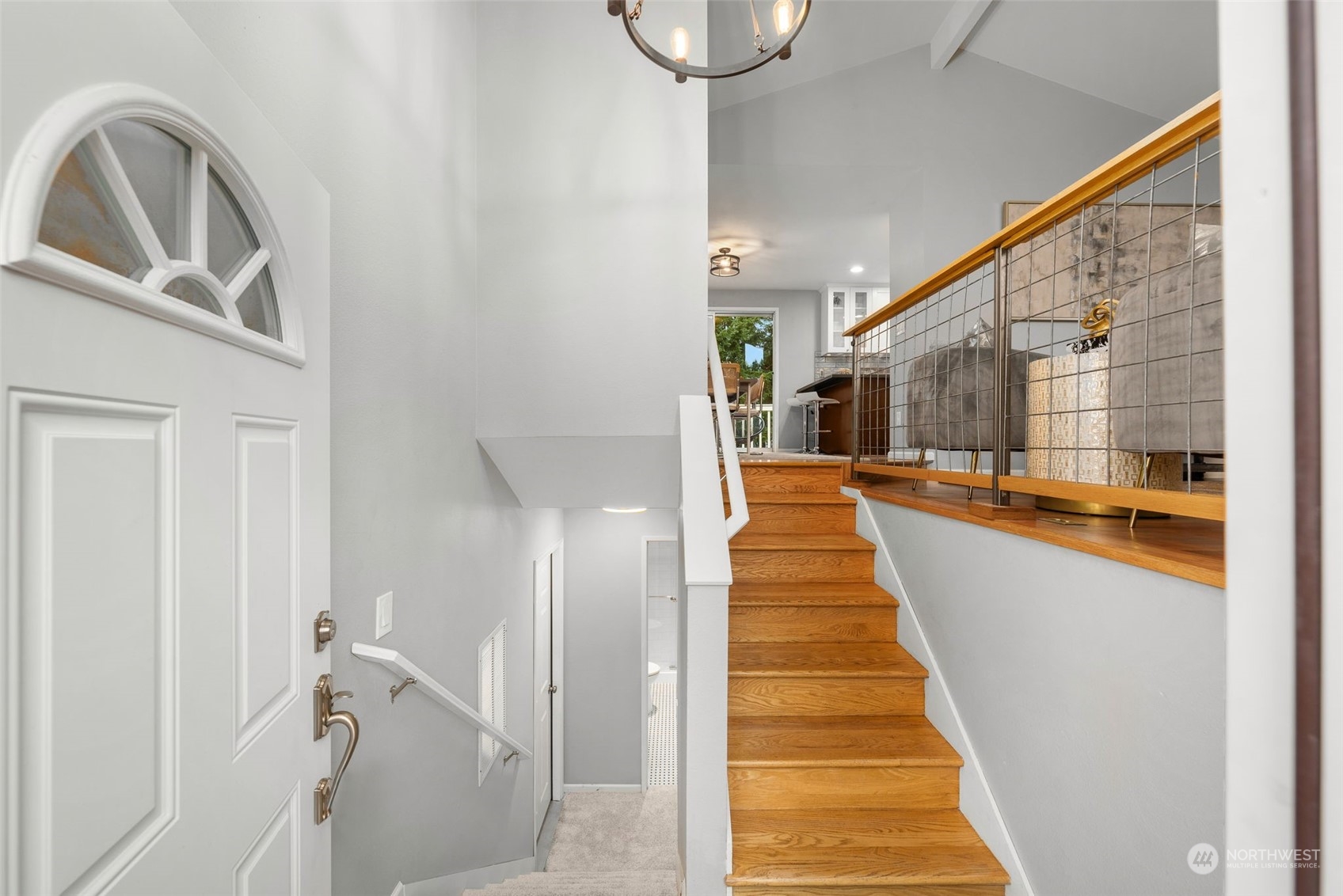 2116 Southeast 21st Street Renton, WA 98055 - Photo 4 of 33 a view of a hallway with wooden floor and staircase